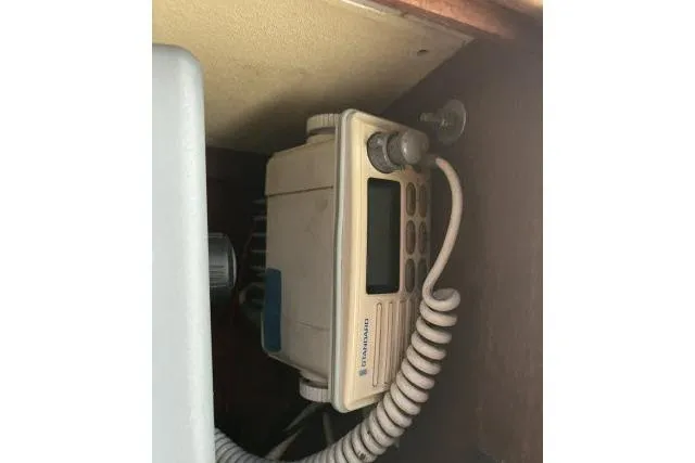 Slide: The Image of Marine radio equipment inside a 1977 Uniflite Valiant 40 sailboat. - 14