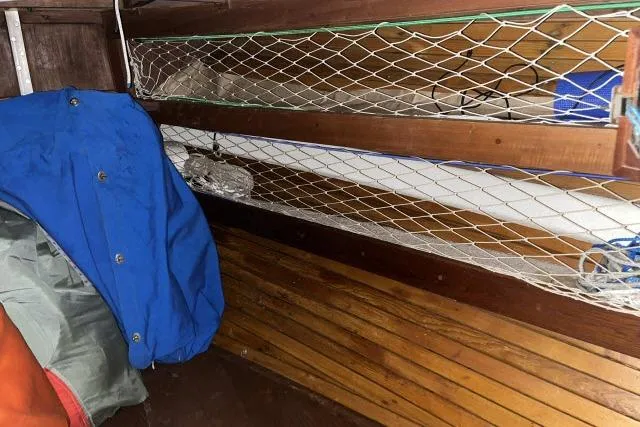 Slide: The Image of Interior of 1977 Uniflite Valiant 40 with wooden paneling and storage netting. - 21