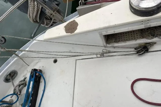 Slide: The Image of 1977 Uniflite Valiant 40 sailboat deck with ropes and hardware details. - 28