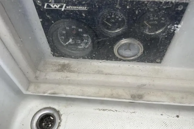 Slide: The Image of Control panel of a 1977 Uniflite Valiant 40 boat with gauges and drain. - 33