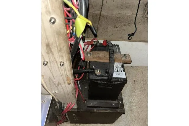 Slide: The Image of Battery setup in a 1977 Uniflite Valiant 40 sailboat, featuring wiring and connections. - 46