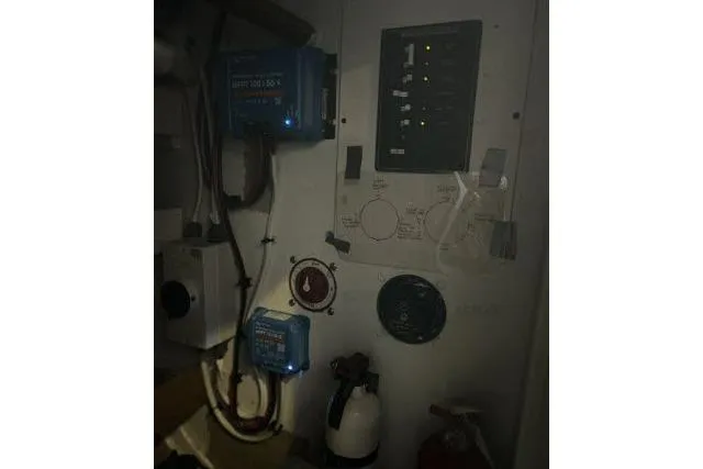 Slide: The Image of Electrical panel and equipment inside a 1977 Uniflite Valiant 40 boat. - 48