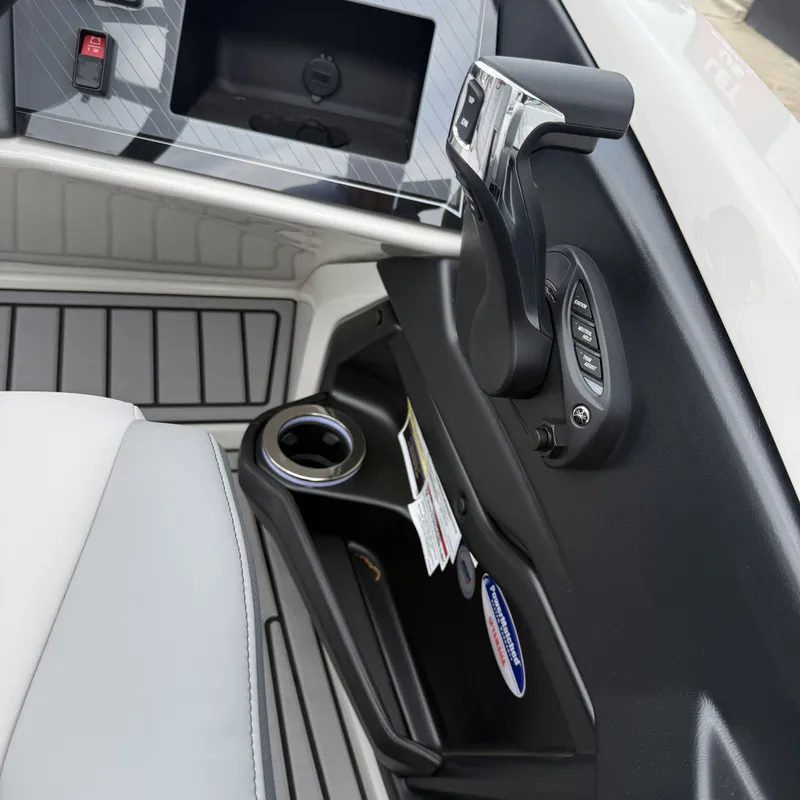 Slide: The Image of Interior of Avalon QLS25T Excalibur 2026 with control console and cup holder. - 31