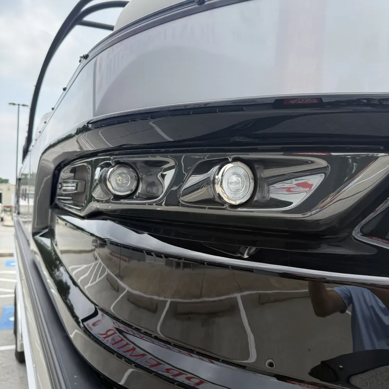 Slide: The Image of Close-up of 2026 Avalon QLS25T Excalibur boat with modern headlights. - 37