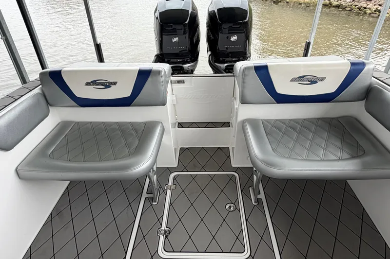 Slide: The Image of 2018 Sunsation 32 CCX boat interior with dual seats and twin Mercury engines. - 15