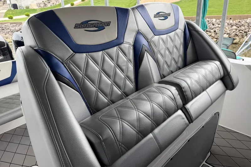 Slide: The Image of 2018 Sunsation 32 CCX boat seats with quilted gray and blue upholstery. - 16