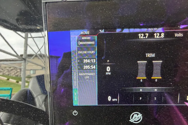 Slide: The Image of Display screen of a 2018 Sunsation 32 CCX showing engine hours and trim settings. - 19