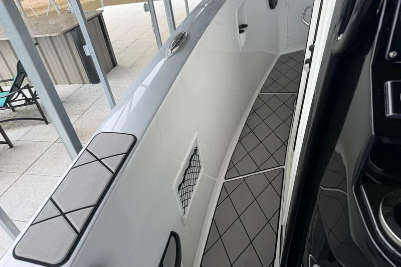 Slide: The Image of 2018 Sunsation 32 CCX boat interior with sleek design and modern flooring. - 22