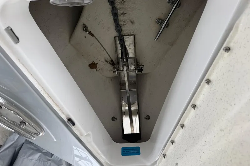 Slide: The Image of Anchor compartment of 2018 Sunsation 32 CCX boat, showcasing chain and mechanism. - 25