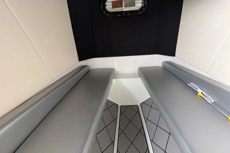Slide: The Image of Interior cabin of 2018 Sunsation 32 CCX boat with cushioned seating and window. - 28