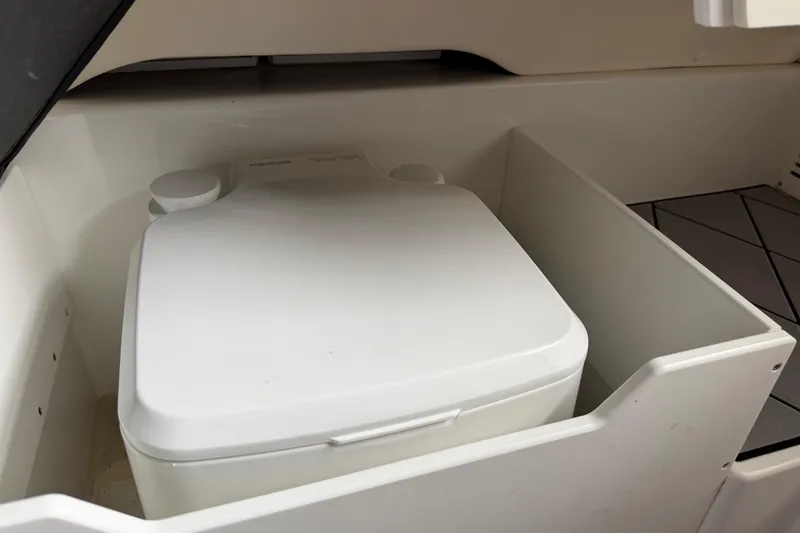 Slide: The Image of Portable toilet in 2018 Sunsation 32 CCX boat storage compartment. - 29