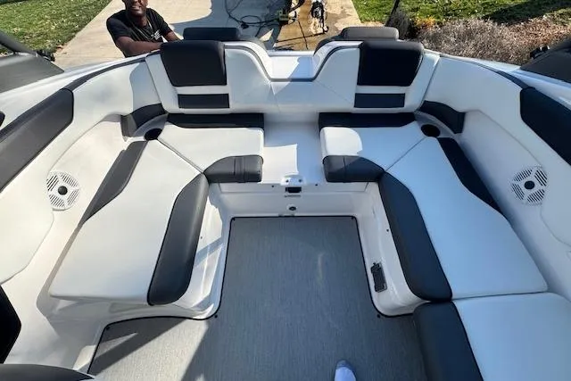 Slide: The Image of 2021 Yamaha AR 210 boat interior with spacious seating and modern design. - 11
