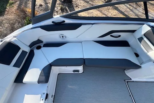 Slide: The Image of 2021 Yamaha AR 210 boat interior with sleek seating and modern design. - 12