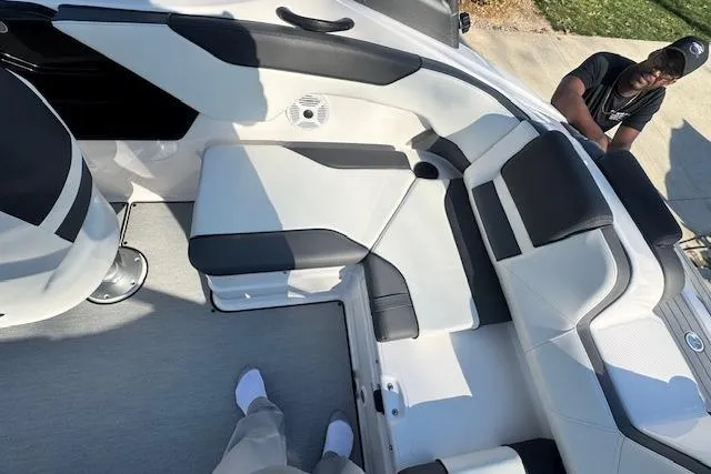 Slide: The Image of 2021 Yamaha AR 210 boat interior with sleek seating and modern design. - 13