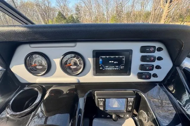 Slide: The Image of Dashboard of 2021 Yamaha AR 210 boat with gauges and control panel. - 17