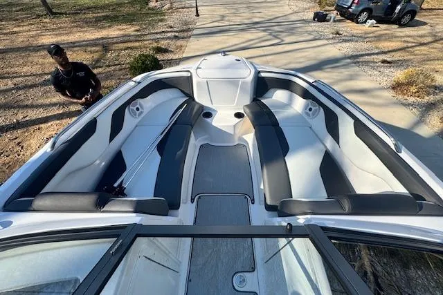 Slide: The Image of 2021 Yamaha AR 210 boat interior with spacious seating and sleek design. - 20