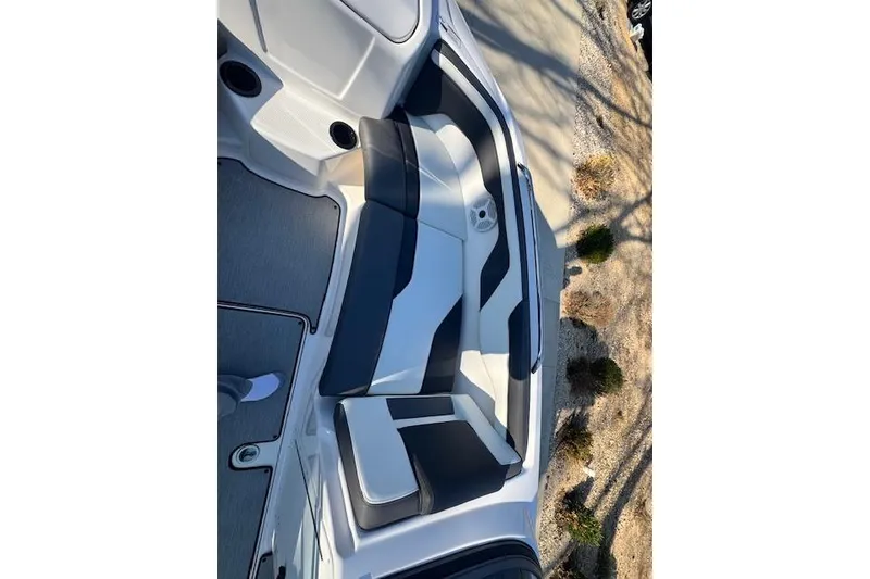 Slide: The Image of 2021 Yamaha AR 210 boat interior with sleek seating and modern design. - 21