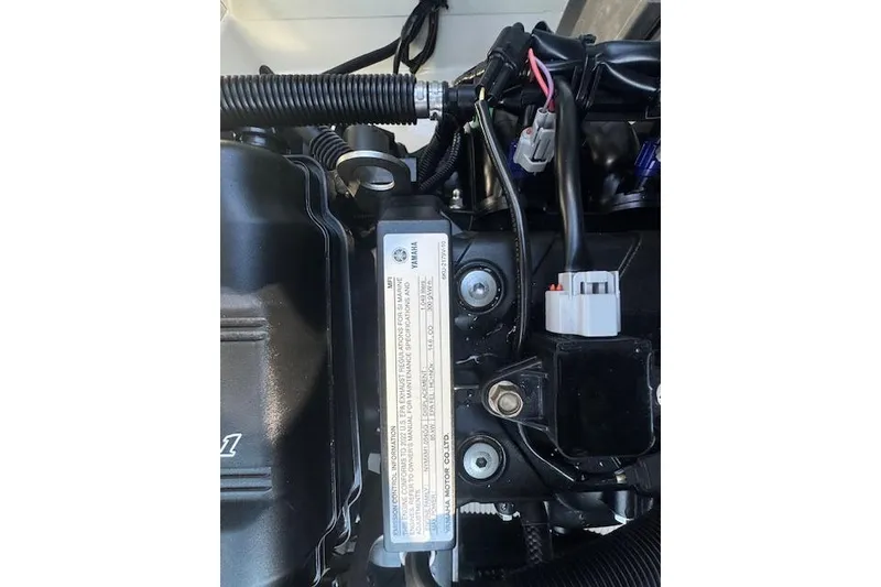 Slide: The Image of 2021 Yamaha AR 210 engine compartment with wiring and components visible. - 28