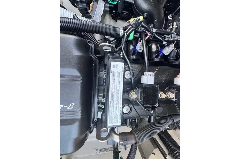 Slide: The Image of Engine components of a 2021 Yamaha AR 210 boat, showcasing wiring and mechanical details. - 29