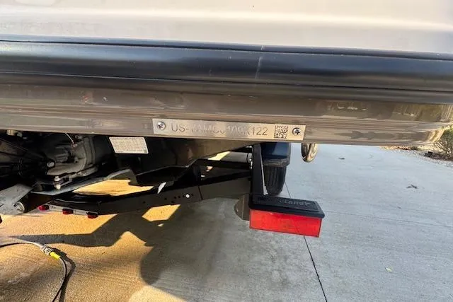 Slide: The Image of Rear view of a 2021 Yamaha AR 210 boat on a trailer, showing identification plate. - 33