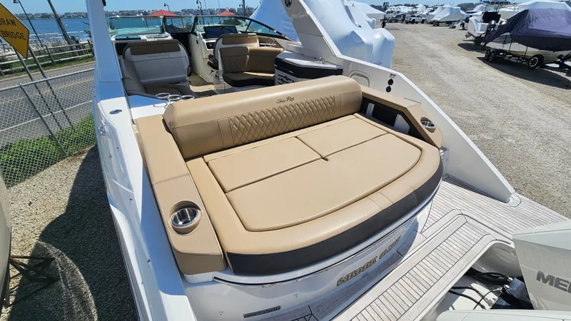 Slide: The Image of 2023 Sea Ray SLX 310 Outboard with luxurious seating area. - 12