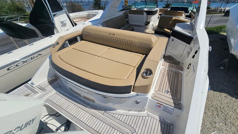 Slide: The Image of 2023 Sea Ray SLX 310 Outboard with luxurious seating area. - 13
