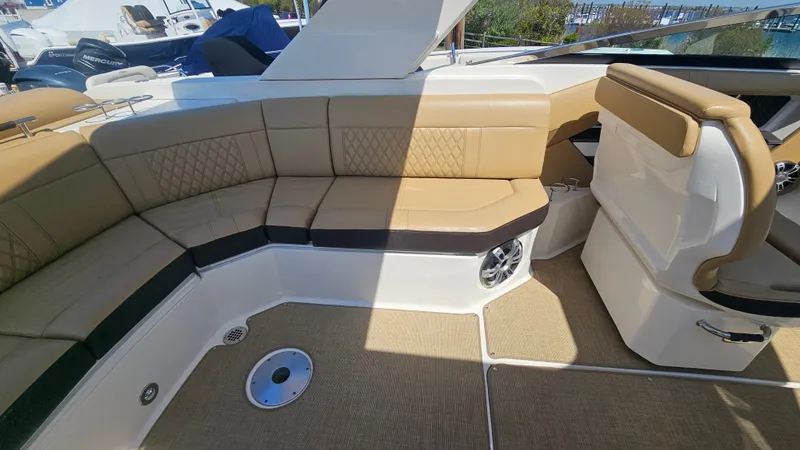 Slide: The Image of Interior of 2023 Sea Ray SLX 310 Outboard with beige seating. - 19
