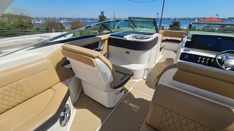 Slide: The Image of Interior of 2023 Sea Ray SLX 310 Outboard with luxurious seating. - 26