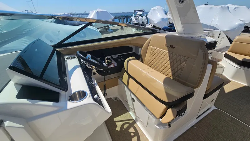 Slide: The Image of Interior of 2023 Sea Ray SLX 310 Outboard with luxurious cockpit. - 28