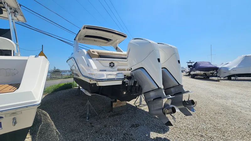 Slide: The Image of 2023 Sea Ray SLX 310 Outboard with dual outboard engines. - 3