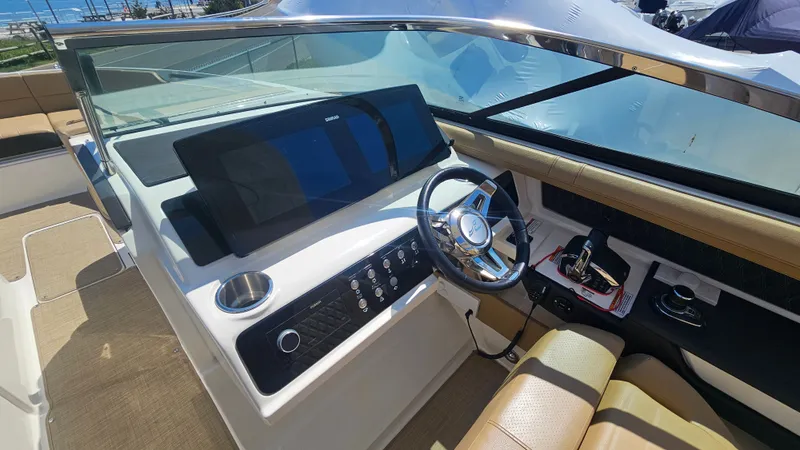 Slide: The Image of Interior view of 2023 Sea Ray SLX 310 Outboard cockpit. - 30