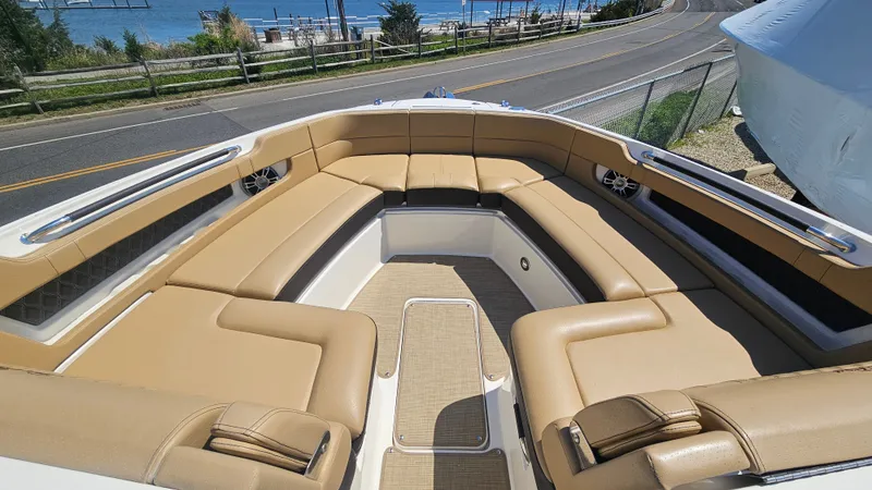 Slide: The Image of Interior of 2023 Sea Ray SLX 310 Outboard with beige seating. - 35