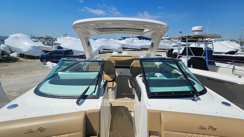 Slide: The Image of 2023 Sea Ray SLX 310 Outboard boat at the marina. - 39