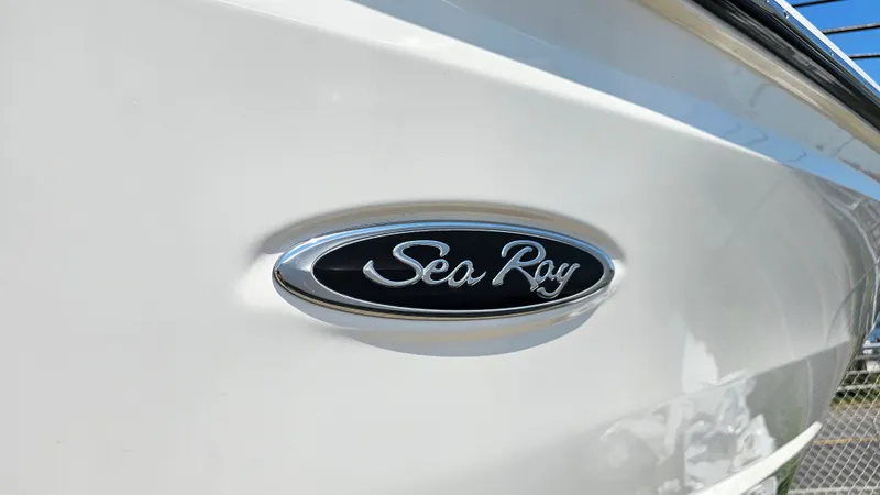 Slide: The Image of 2023 Sea Ray SLX 310 Outboard logo on white hull. - 7