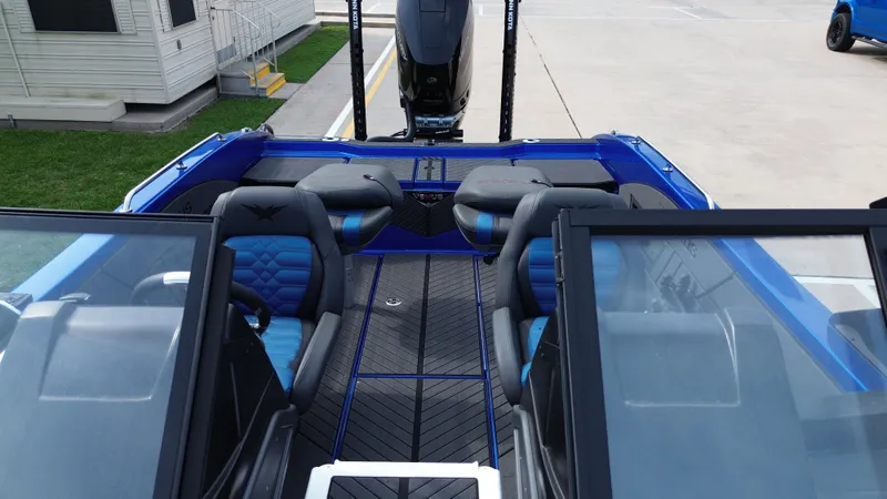 Slide: The Image of Interior of a blue 2025 Vexus DVX22S boat with modern seating. - 22