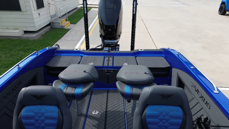 Slide: The Image of Interior of 2025 Vexus DVX22S boat with blue seating. - 23