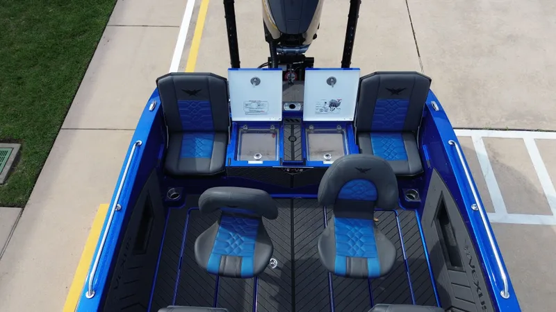 Slide: The Image of Interior view of 2025 Vexus DVX22S boat with blue seating. - 30
