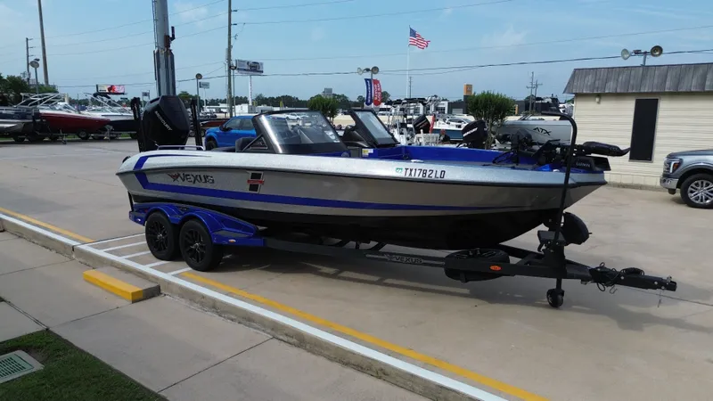 Slide: The Image of 2025 Vexus DVX22S boat parked on trailer outdoors. - 8