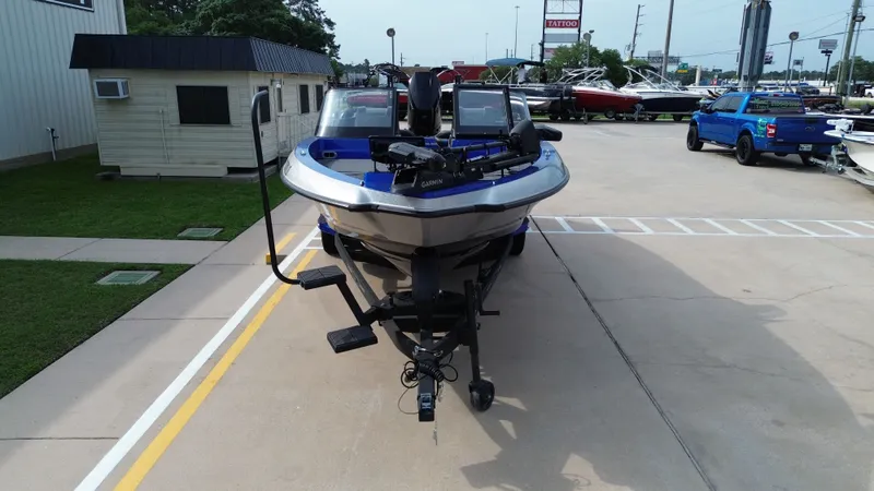 Slide: The Image of 2025 Vexus DVX22S boat on a parking lot. - 9