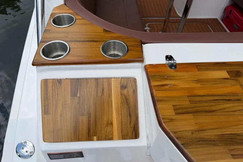 Slide: The Image of Luxury teak deck of 2025 NX Boats 340 Sport Coupe with cup holders. - 26