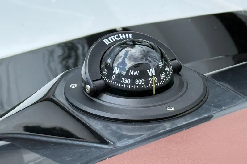 Slide: The Image of Compass on NX Boats 340 Sport Coupe, 2025 model, showing northwest direction. - 51