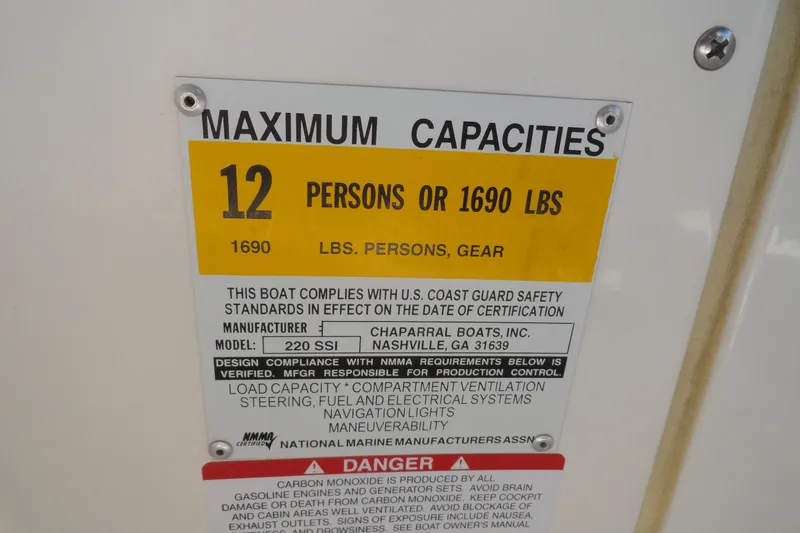 Slide: The Image of 2003 Chaparral 220 SSi capacity plate: 12 persons or 1690 lbs maximum load. - 12
