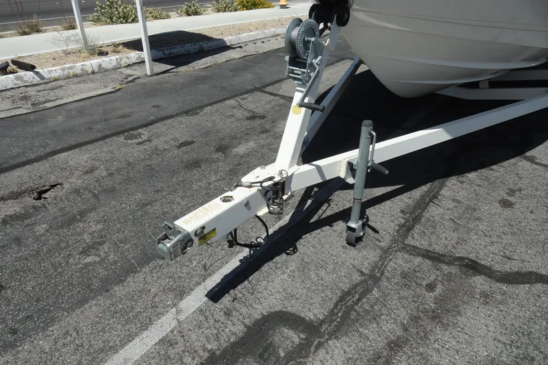 Slide: The Image of Trailer hitch of a 2003 Chaparral 220 SSi boat on pavement. - 19
