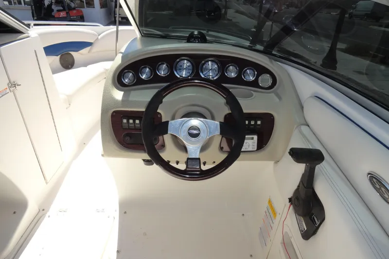 Slide: The Image of 2003 Chaparral 220 SSi boat dashboard with steering wheel and instrument panel. - 8