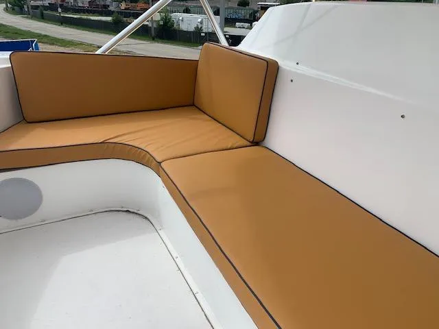 Slide: The Image of Tan cushioned seating on 2002 Viking 55 Convertible yacht deck. - 21