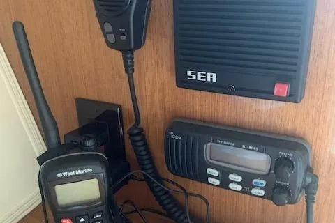 Slide: The Image of Communication equipment on a 2002 Viking 55 Convertible yacht, featuring radios and microphones. - 24