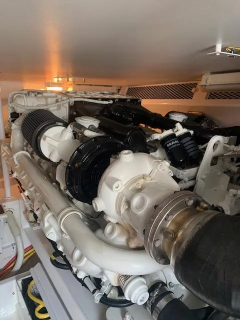 Slide: The Image of Engine room of 2002 Viking 55 Convertible yacht, showcasing detailed mechanical components. - 37