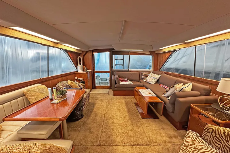 Slide: The Image of Luxurious interior of a 1988 Ocean Yachts 48 Super Sport with plush seating and elegant decor. - 13