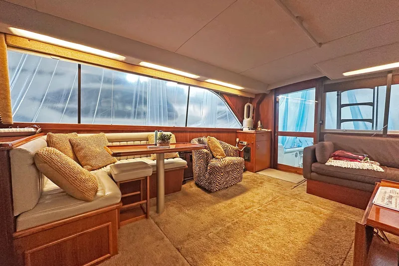 Slide: The Image of Luxurious interior of 1988 Ocean Yachts 48 Super Sport with plush seating and elegant decor. - 14