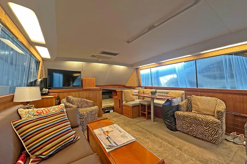 Slide: The Image of Luxurious interior of 1988 Ocean Yachts 48 Super Sport with cozy seating and modern decor. - 15